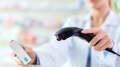 Pharmacist scanning product
